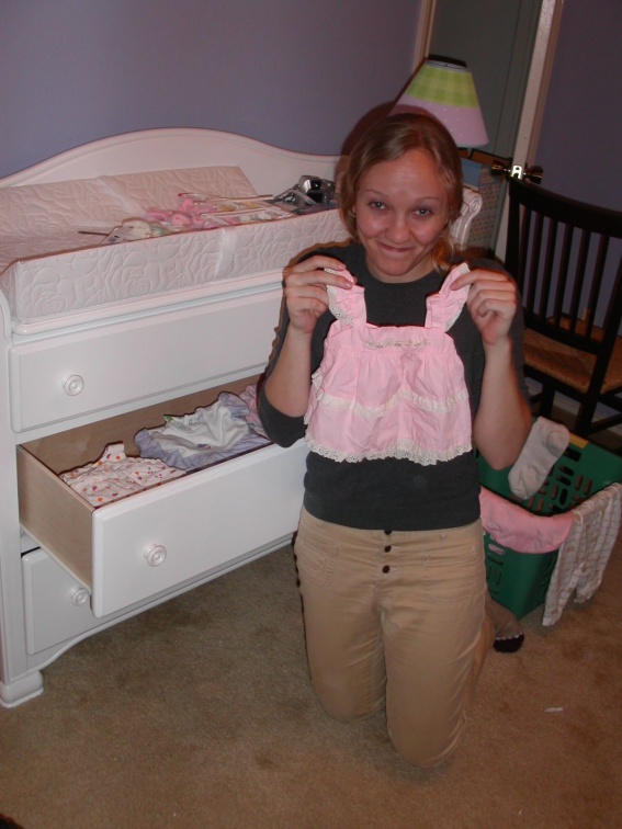 amy with baby clothes
