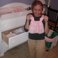 amy with baby clothes