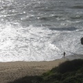 naked man by the ocean